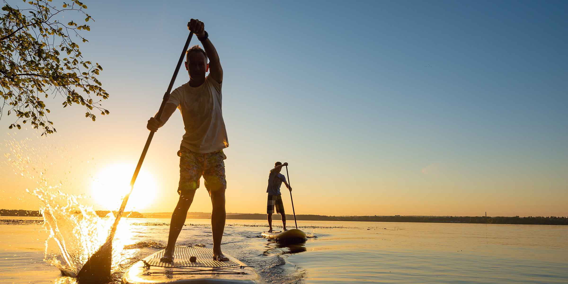 2 men on paddle board